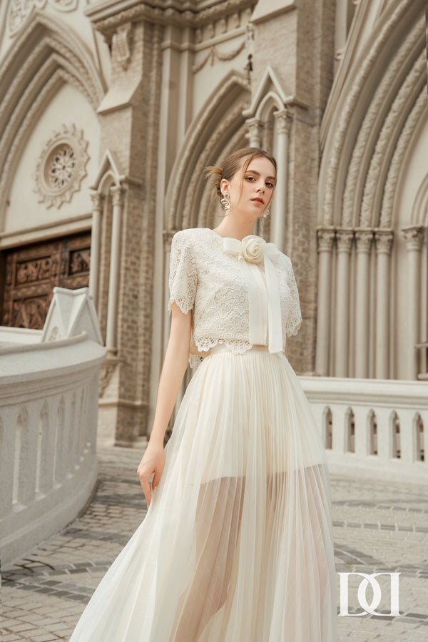 Lelys Set - Áo Crop-top Tay Ngắn Kèm Nơ Hoa & Chân Váy Midi Xếp Ly